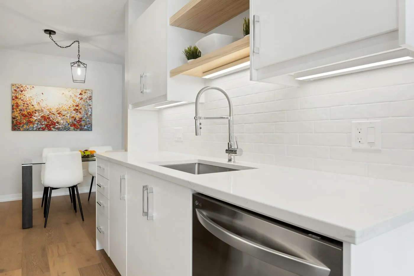 Illustrative home kitchen showing the sink, countertop and tiled backsplash